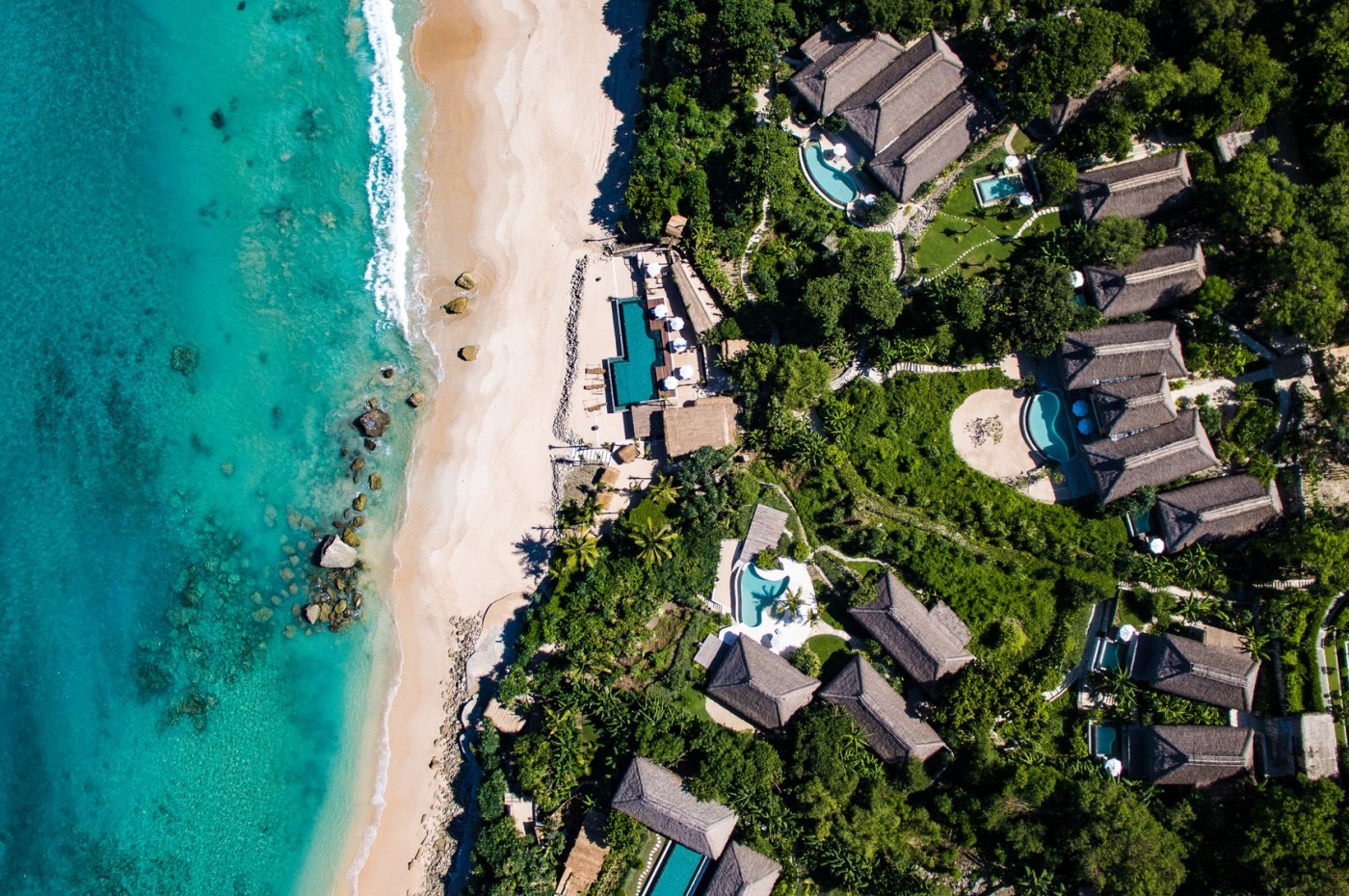 aerial of water, beach and NIHI Sumba, Indonesia