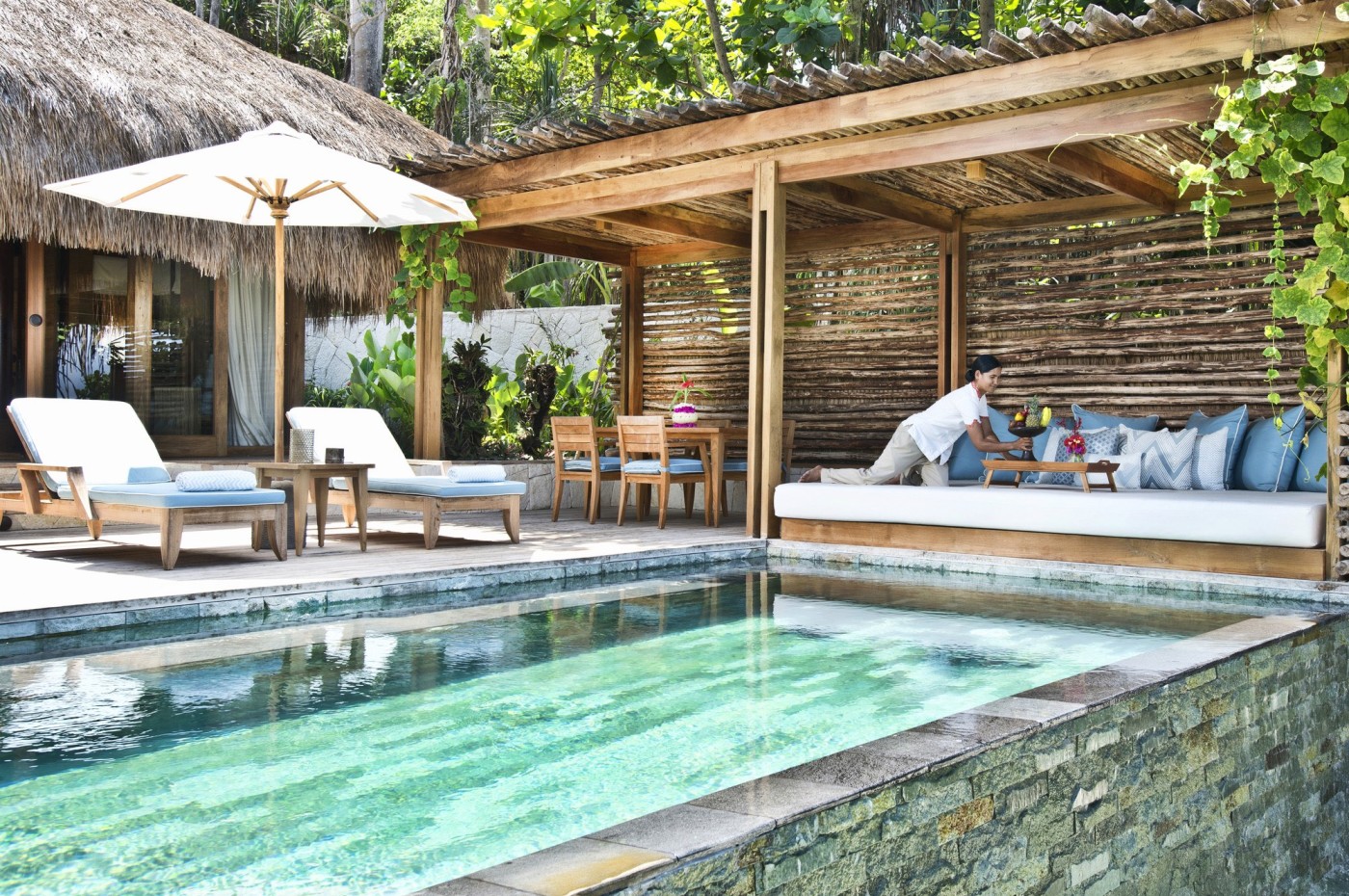 pool villa and staff at NIHI Sumba, Indonesia