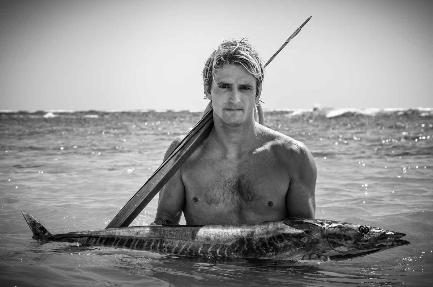 man with a fish at NIHI Sumba, Indonesia