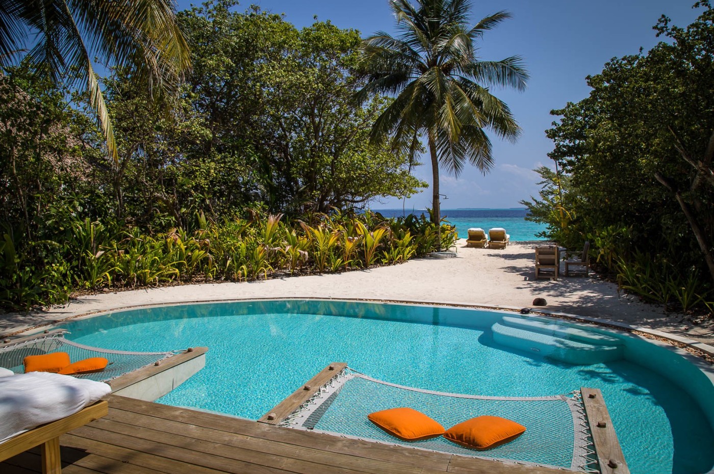 villa pool and view to the beach at Soneva Fushi, Maldives
