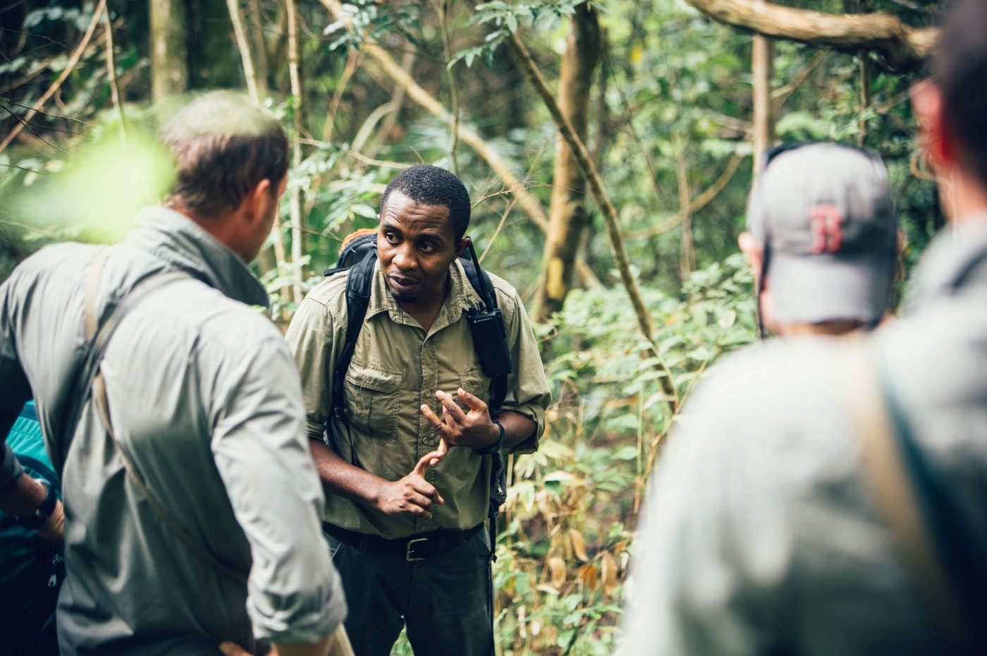 guide and travelers in the foreste around Greystoke Mahale, Tanzania