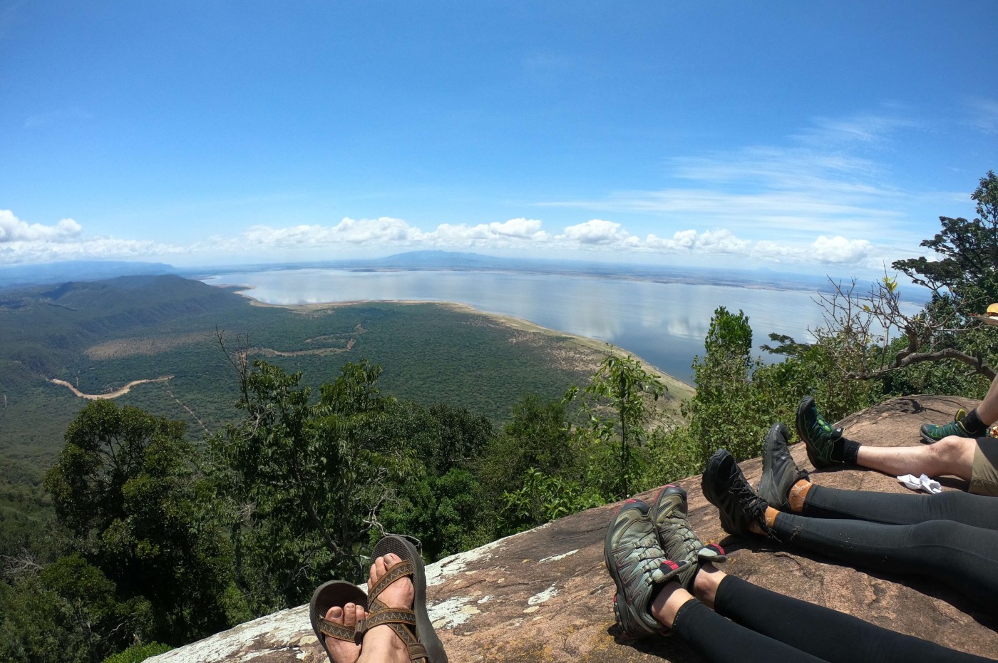 Feet and panorama photo of nature and Laka Manyara Tanzania