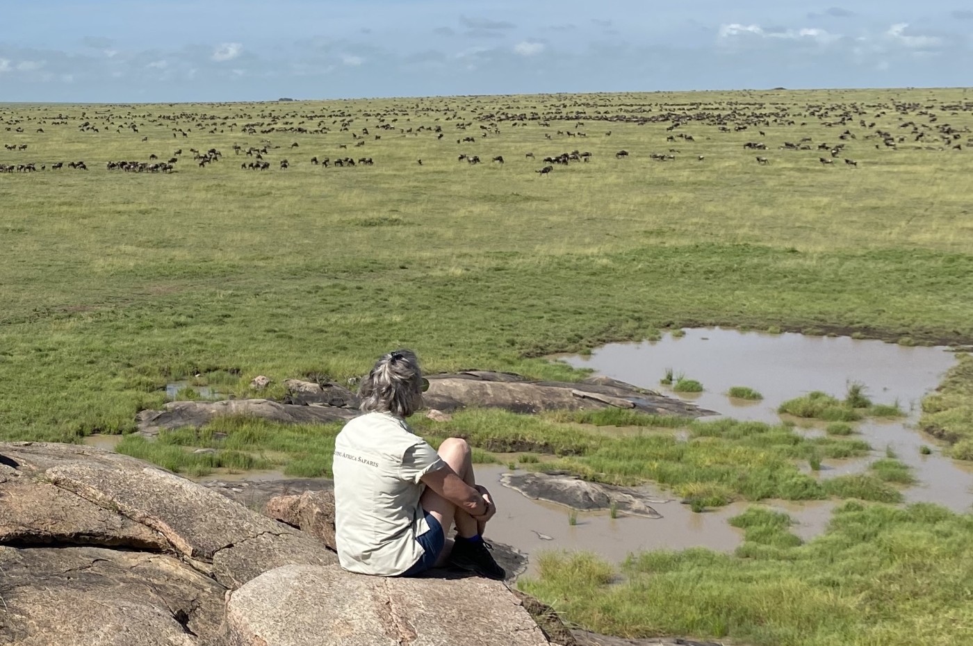 person looking over the savannah, Wayo Walking Safari Camp, Serengeti, Tanzania