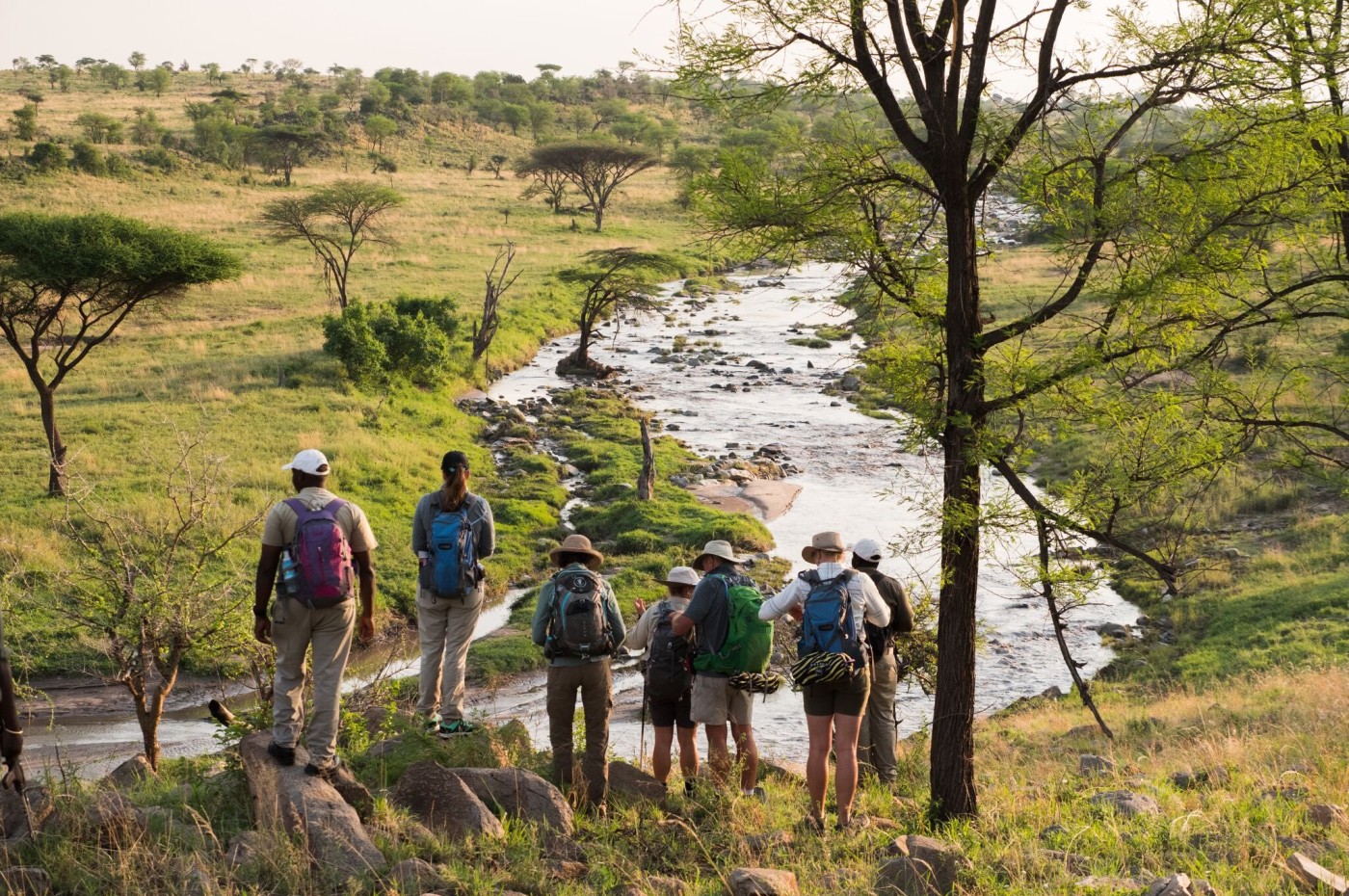 people looking over the river at Wayo Walking Safari Camp, Serengeti, Tanzania