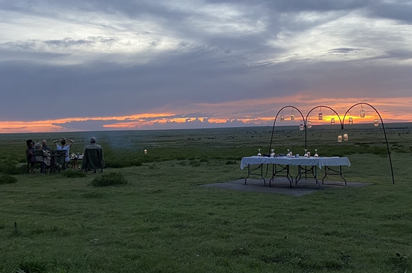 table set during sunset at Wayo Walking Safari Camp, Serengeti, Tanzania