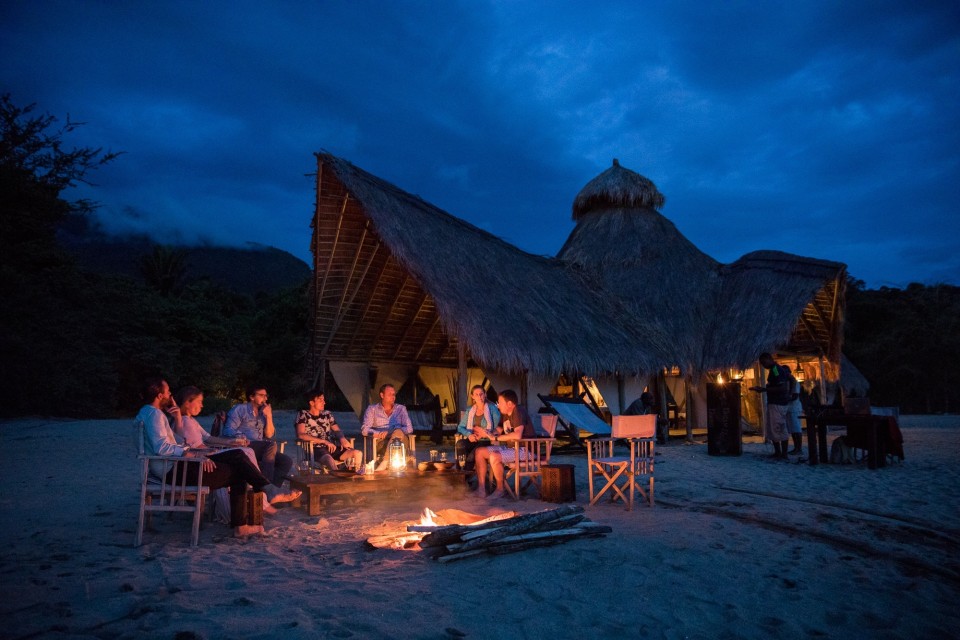 people around the bonfire at Greystoke Mahale, Tanzania